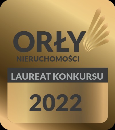 Złote godło 'Orły Nieruchomości', laureat konkursu 2022, na kwadratowym tle z gradientem.
