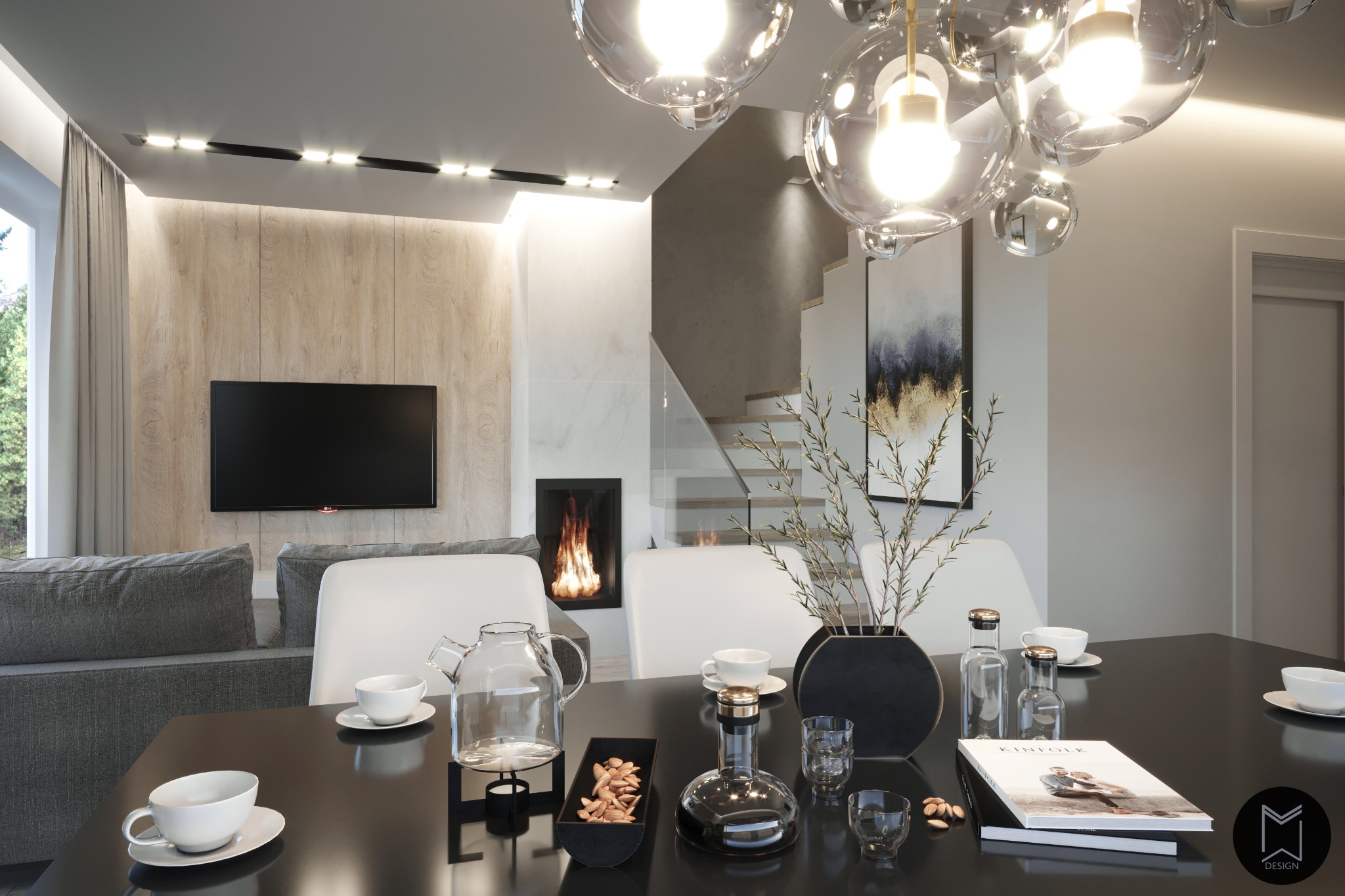 Nowoczesne wnętrze jadalni z czarnym stołem, szklanym czajnikiem i dekoracyjnymi elementami, w tle kominek i schody.