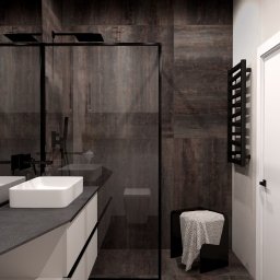 Studio 4.0 - Projektowanie wnętrz - Nowoczesna łazienka z ciemnymi, rdzawymi płytkami imitującymi metal, kabina prysznicowa walk-in z czarną ramą, biała umywalka nablatowa na szarym blacie, czarny grzejnik drabinkowy i czarne akcenty.