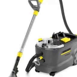 Profesjonalny odkurzacz piorący Karcher z przezroczystą dyszą i zbiornikiem, widoczne detale w kolorze żółtym.