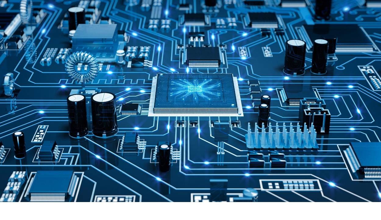 Szczegółowe ujęcie płyty głównej komputera z wyraźnie zaznaczonym centralnym procesorem i ścieżkami przewodzącymi, oświetlonymi niebieskim światłem.