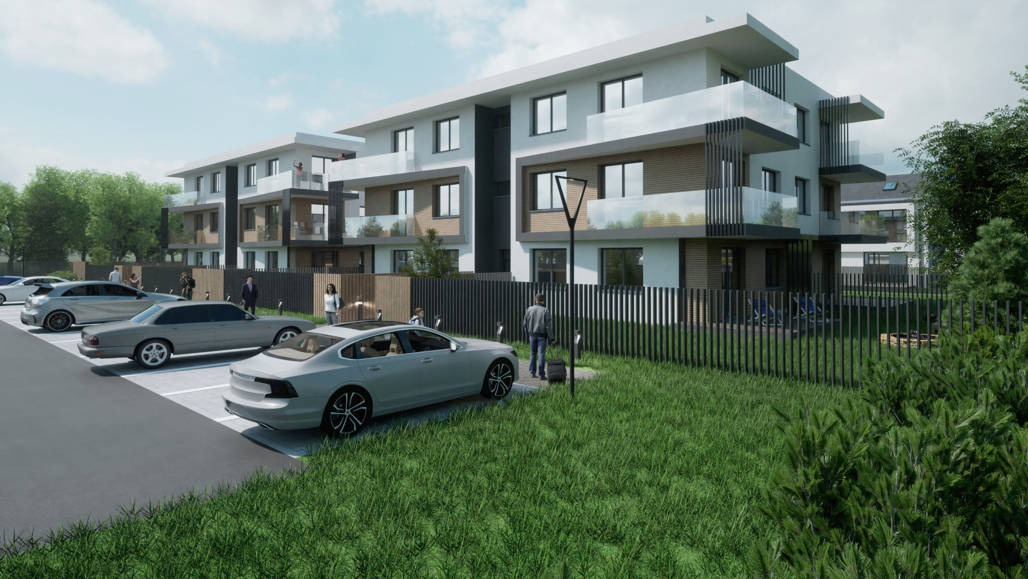 Wizualizacja osiedla nowoczesnych budynków wielorodzinnych z balkonami, parkingiem i ogrodzeniem, z uwzględnieniem zieleni i oświetlenia zewnętrznego.
