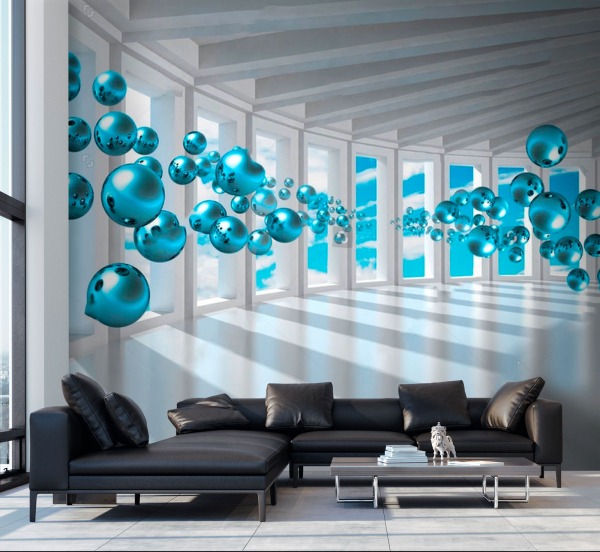 Nowoczesny salon z czarną skórzaną sofą, stolikiem kawowym i fotorealistyczną tapetą 3D przedstawiającą białe kolumny z widokiem na błękitne niebo oraz unoszące się turkusowe kule.