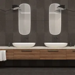 Nowoczesna łazienka z dwoma owalnymi umywalkami nablatowymi, drewnianą szafką pod umywalką, podwieszanymi lampami nad lustrami i grzejnikiem drabinkowym na ścianie z geometrycznym wzorem.