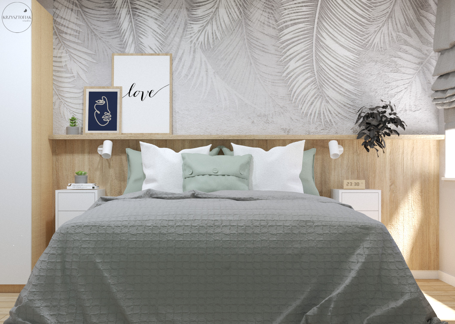 Jasna sypialnia z tapetą w liście palmowe, drewnianym panelem za łóżkiem, białymi szafkami nocnymi i szarozieloną narzutą na łóżku.