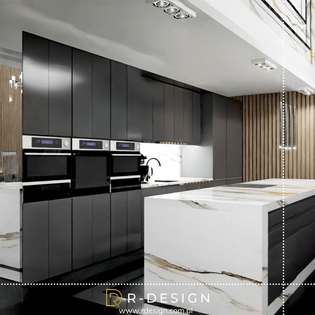 Nowoczesna kuchnia z czarnymi szafkami, trzema piekarnikami w zabudowie i wyspą wykończoną marmurem z wyraźnym złotym użyleniem, oświetlenie punktowe.
