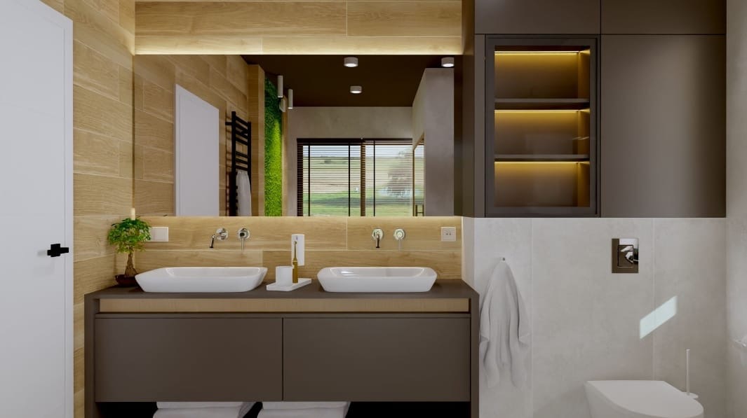 Nowoczesna łazienka z dwoma białymi umywalkami nablatowymi, drewnopodobnymi płytkami na ścianie, dużym lustrem z podświetleniem LED i szafką pod umywalką w kolorze ciemnego brązu.