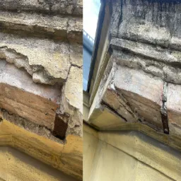 Uszkodzony, ceglany gzyms z odpadającym tynkiem, widoczne pęknięcia i ubytki, wymagający naprawy.