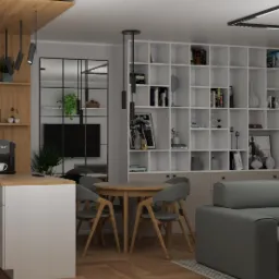 Wizualizacja wnętrza mieszkania: biała kuchnia z drewnianym blatem, okrągły stół z szarymi krzesłami i duża biała biblioteczka z dekoracjami, szara sofa.