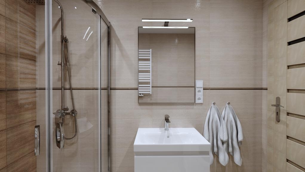 Nowoczesna łazienka z kabiną prysznicową, umywalką nablatową, lustrem z oświetleniem LED i grzejnikiem drabinkowym, utrzymana w beżowej kolorystyce z drewnianymi akcentami.