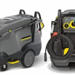 Profesjonalna, szaro-czarna myjka ciśnieniowa Kärcher z żółtymi akcentami i wężem zwiniętym z tyłu, widoczna z dwóch perspektyw na białym tle.