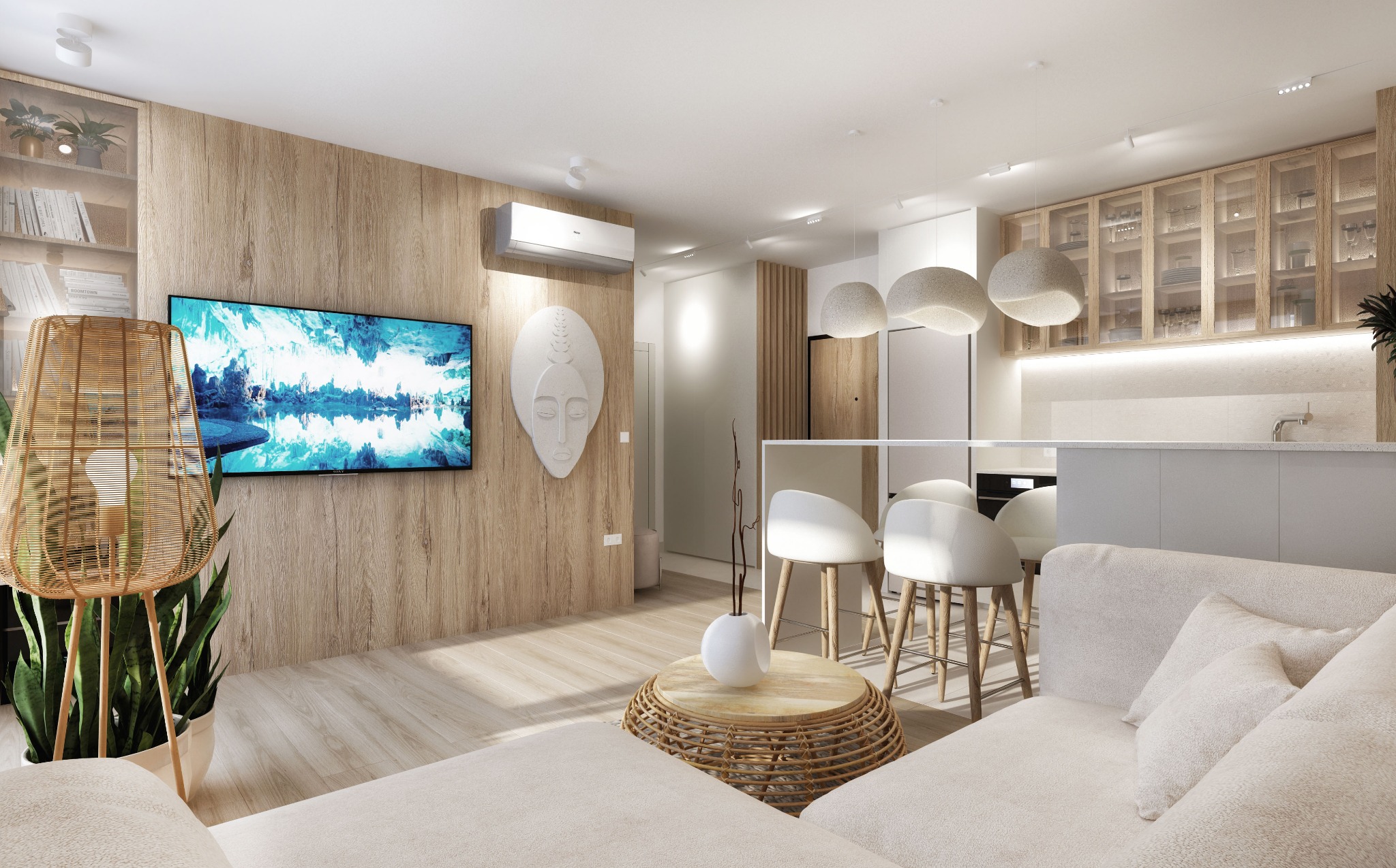 Jasne, nowoczesne wnętrze mieszkania z drewnianą ścianą, telewizorem z abstrakcyjnym obrazem, dekoracyjną maską, rattanowym stolikiem i lampą oraz otwartą kuchnią z białymi szafkami i hokerami.