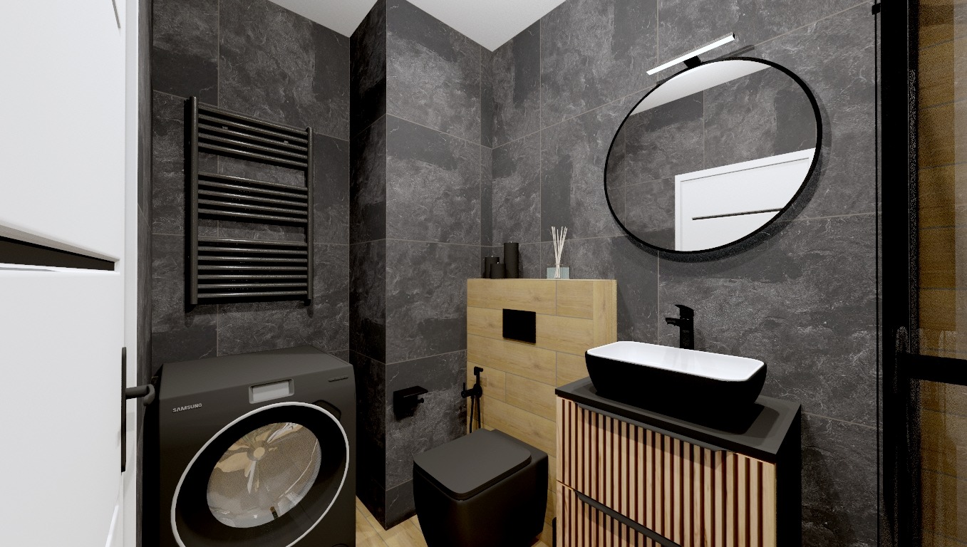 Nowoczesna łazienka z czarną pralką Samsung, grzejnikiem drabinkowym, umywalką nablatową i okrągłym lustrem z podświetleniem LED, wykończona płytkami imitującymi kamień.