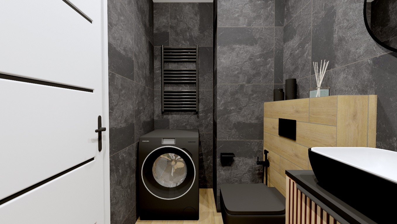 Nowoczesna łazienka z czarną pralką Samsung, grzejnikiem drabinkowym, umywalką nablatową na szafce z drewnianymi lamelami i toaletą w kolorze czarnym, szare płytki na ścianach i białe drzwi...
