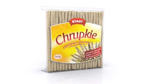 Wizualizacja opakowania chrupiącego pieczywa pszennego Rymut w przezroczystej folii, z żółto-białym tłem etykiety i motywem kłosów pszenicy, prezentowana na białym tle.