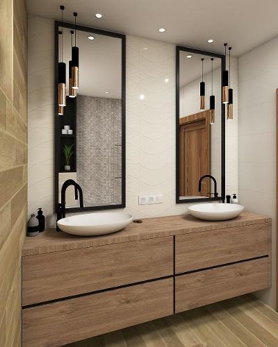 Nowoczesna łazienka z dwoma owalnymi umywalkami nablatowymi, czarnymi bateriami, drewnianą szafką pod umywalką z czarnymi uchwytami oraz dwoma podłużnymi lustrami w czarnych ramach z wiszącymi...