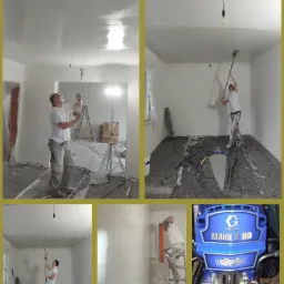 Praca malarza natryskowego podczas malowania ścian i sufitu w pomieszczeniu, widoczny agregat malarski Graco Mark X HD, podłoga zabezpieczona folią ochronną.