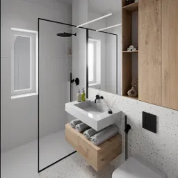 Nowoczesna łazienka z kabiną prysznicową typu walk-in, umywalką nablatową na drewnianej szafce, wiszącą toaletą i płytkami lastryko na podłodze i ścianie.