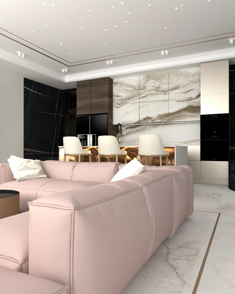 Nowoczesne wnętrze: różowa sofa modułowa na marmurowej podłodze z złotymi akcentami, otwarta kuchnia z marmurowym blatem i czarnymi frontami.