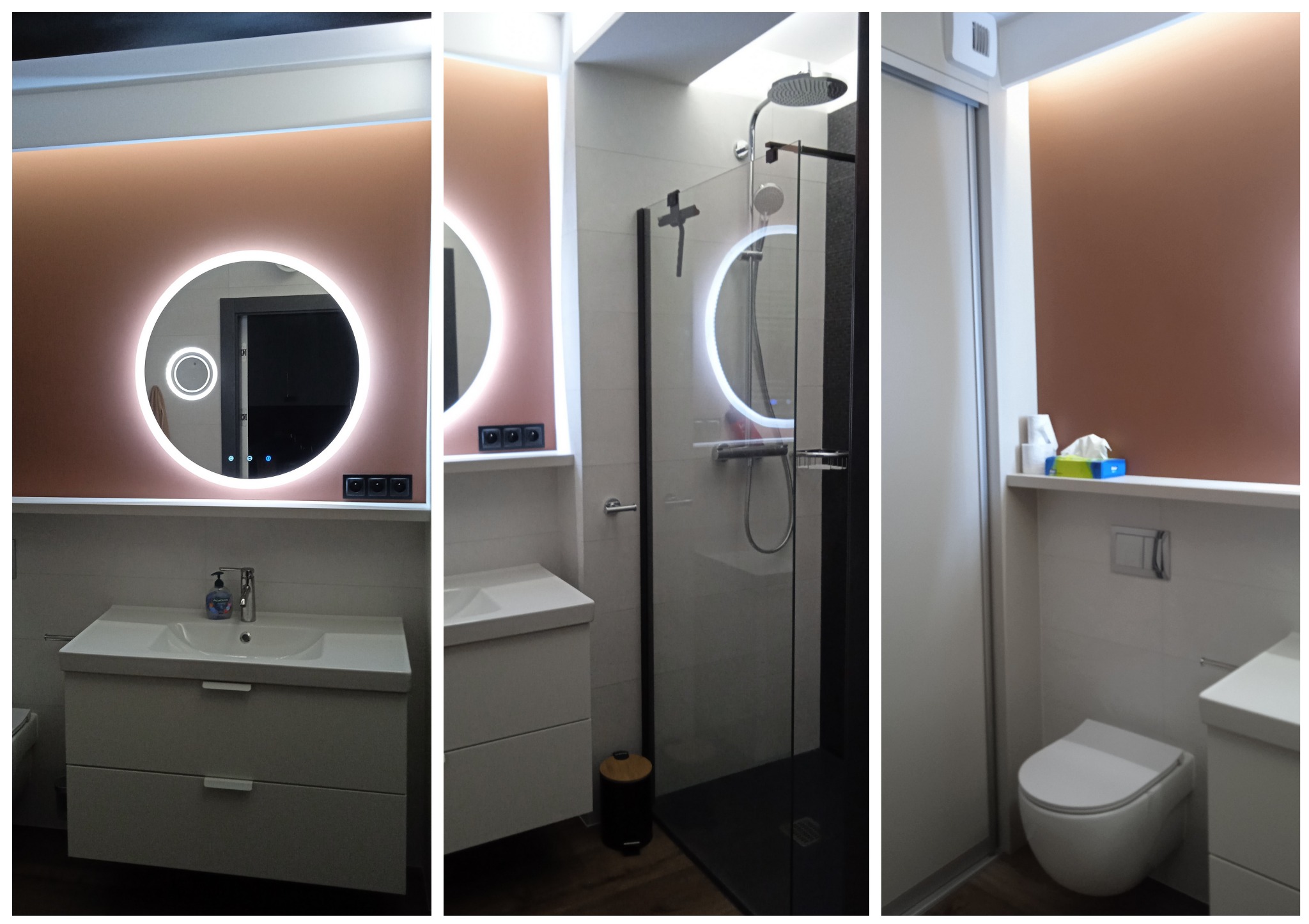 Nowoczesna łazienka po remoncie: okrągłe lustro z podświetleniem LED, kabina prysznicowa z czarnymi elementami i biała umywalka z szafką. Oświetlenie górne.