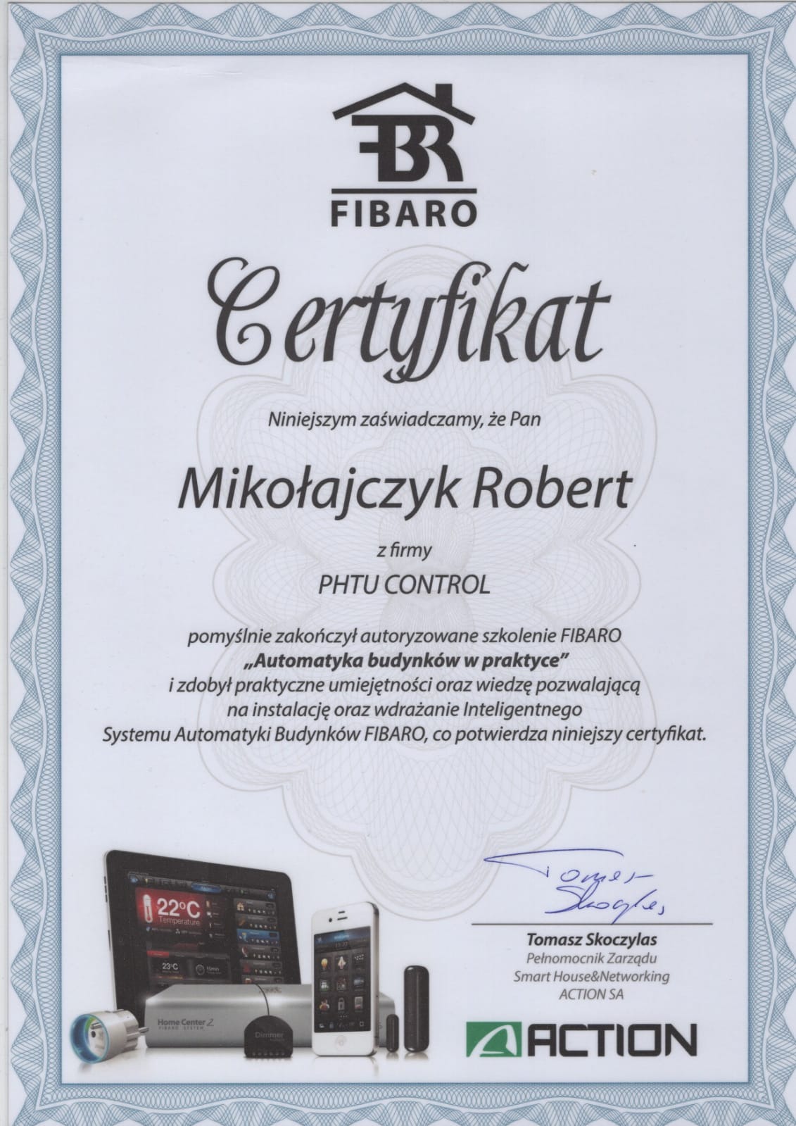 Certyfikat ukończenia szkolenia FIBARO z zakresu automatyki budynków, z elementami systemu inteligentnego domu widocznymi na ilustracji w dolnej części dokumentu.