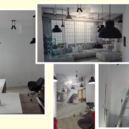 Arteria Studio Wnętrz- usługi remontowe - Wnętrze biura w trakcie malowania, z widoczną drabiną opartą o ścianę, biurkiem z rozłożonymi planami i fototapetą z motywem loftowym na ścianie w tle.