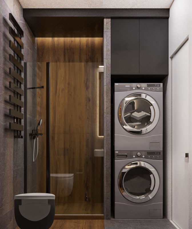 Nowoczesna łazienka z kabiną prysznicową typu walk-in z drewnianą ścianą, wiszącą toaletą i pralko-suszarką w zabudowie.