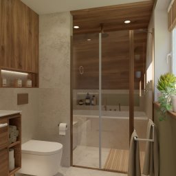 ProReal Studio Justyna Kępa - Nowoczesna łazienka z drewnianymi akcentami: kabina prysznicowa typu walk-in, wisząca toaleta, szafka z ręcznikami i rośliny doniczkowe przy oknie. Ciepłe oświetlenie.
