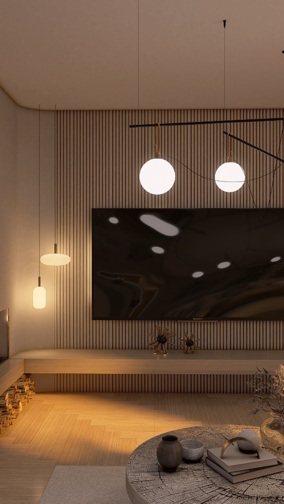 Nowoczesny salon z drewnianą ścianą, okrągłym stolikiem kawowym i designerskimi lampami wiszącymi. Minimalistyczny wystrój z telewizorem i dekoracjami.