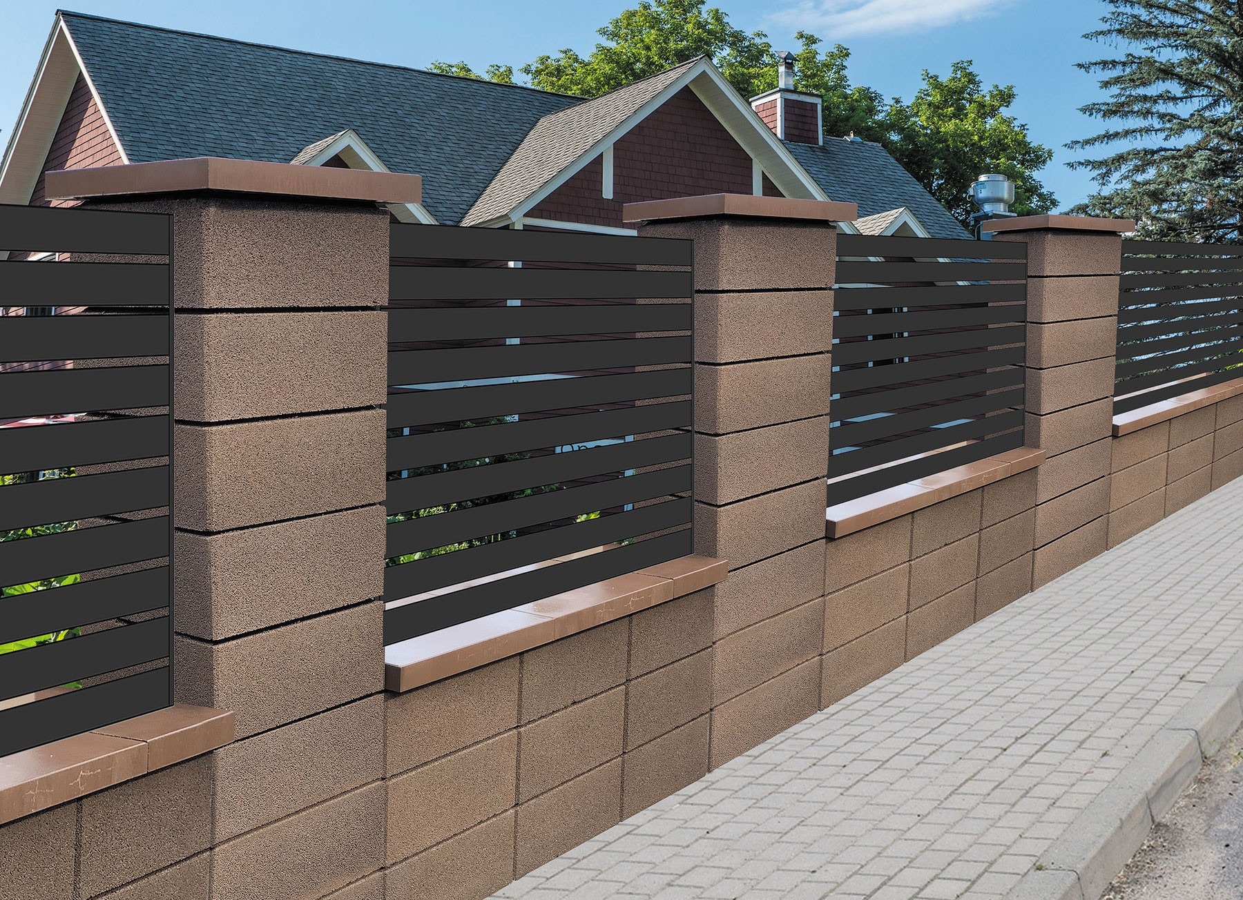 Nowoczesne ogrodzenie z poziomych, czarnych paneli zamontowanych między brązowymi słupkami z bloków betonowych, Kraków. Widoczna kostka brukowa chodnika i fragment domu w tle.