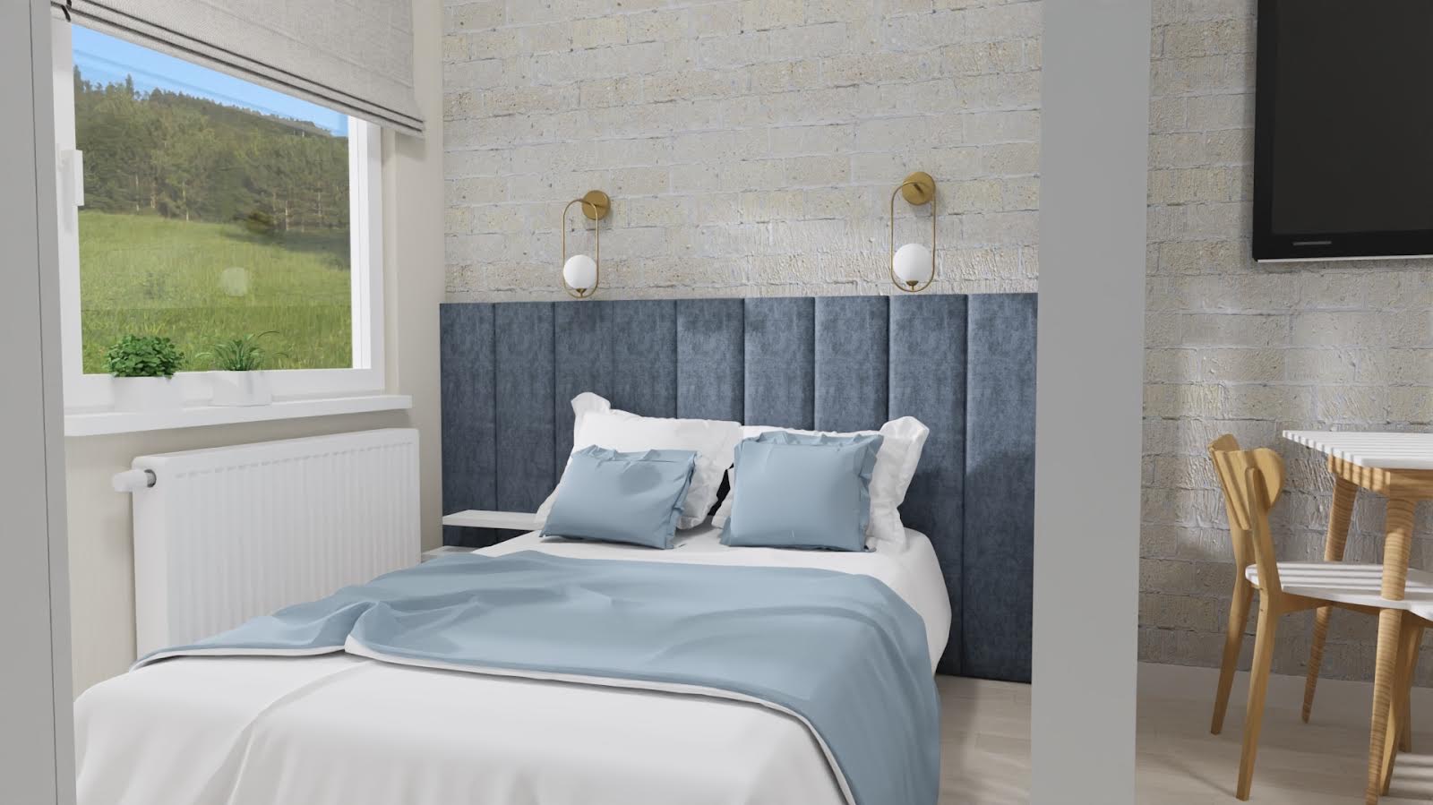Nowoczesna sypialnia z ceglaną ścianą, niebieskim tapicerowanym zagłówkiem, białymi meblami i widokiem na zieleń za oknem.