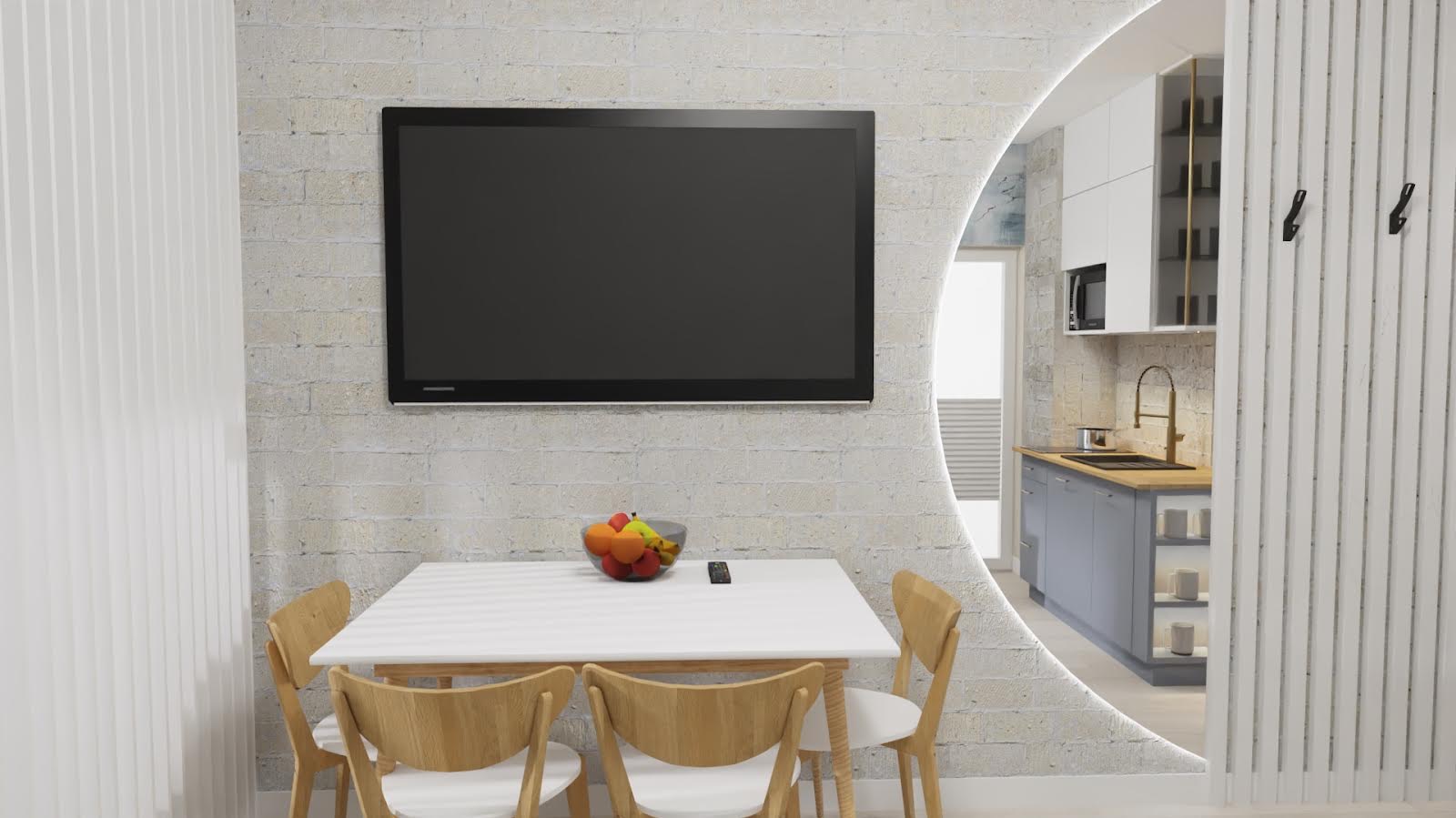 Wnętrze mieszkania z ceglaną ścianą, telewizorem, stołem z owocami i widokiem na kuchnię przez okrągłe przejście z oświetleniem LED.