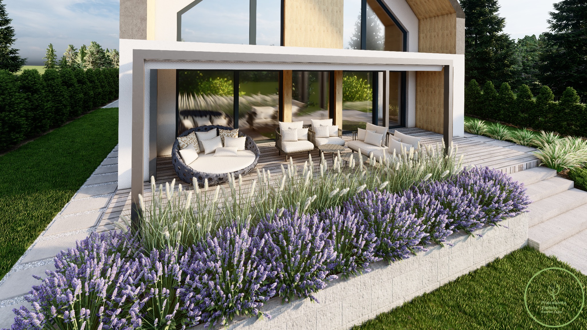 Nowoczesny taras z drewnianą podłogą, okrągłym szezlongiem z poduszkami, białymi fotelami i kanapą, ozdobiony rabatą z lawendy i traw ozdobnych.