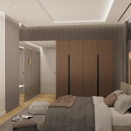 Cognac Architects - Wizualizacja sypialni w stonowanych barwach z dużym łóżkiem, drewnianą zabudową i okrągłą lampą wiszącą z elementami czerni i złota.