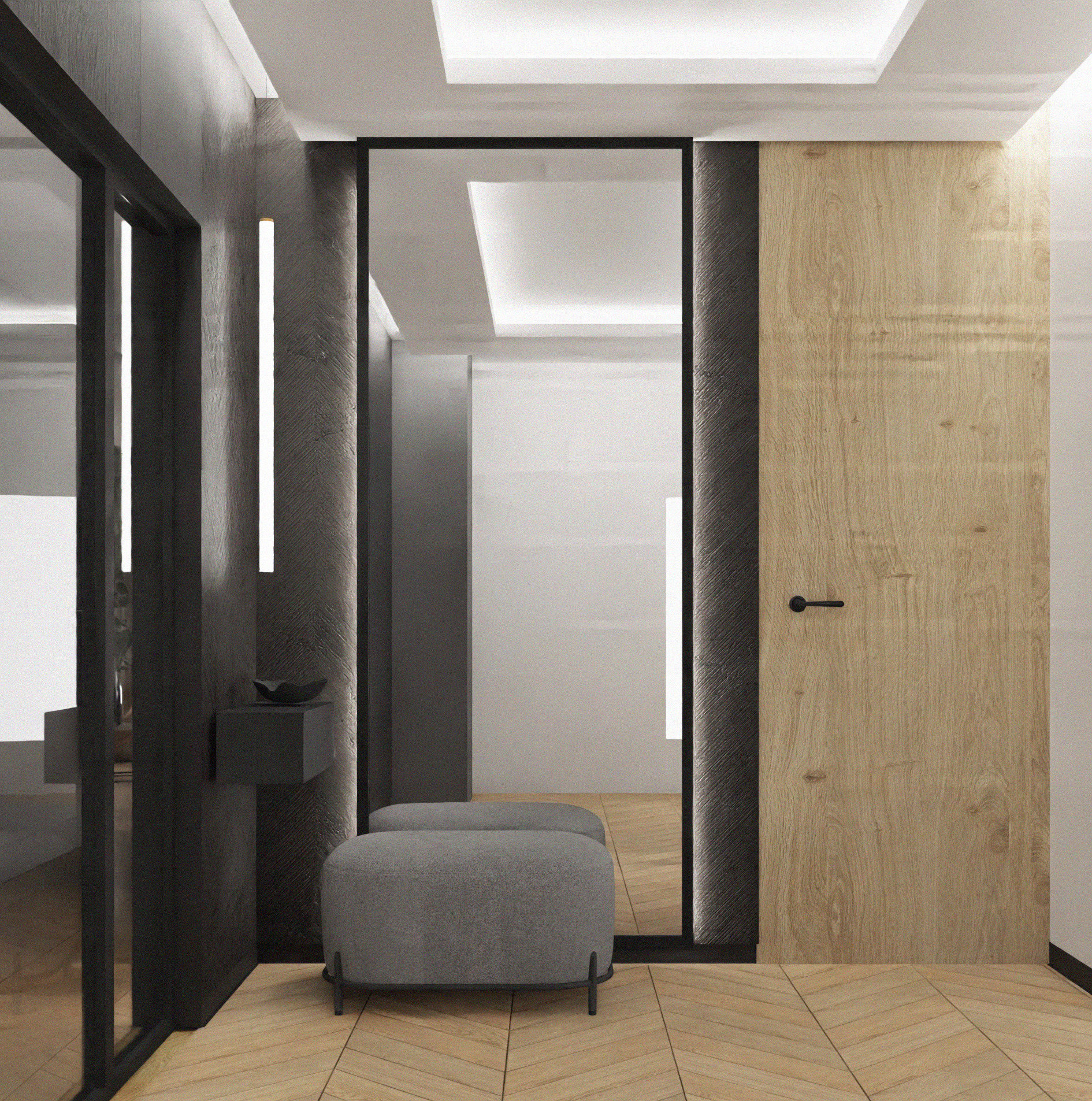 Nowoczesny przedpokój z drewnianą podłogą ułożoną w jodełkę, szarymi ścianami z oświetleniem LED, lustrem w czarnej ramie i pufami w kolorze szarym.