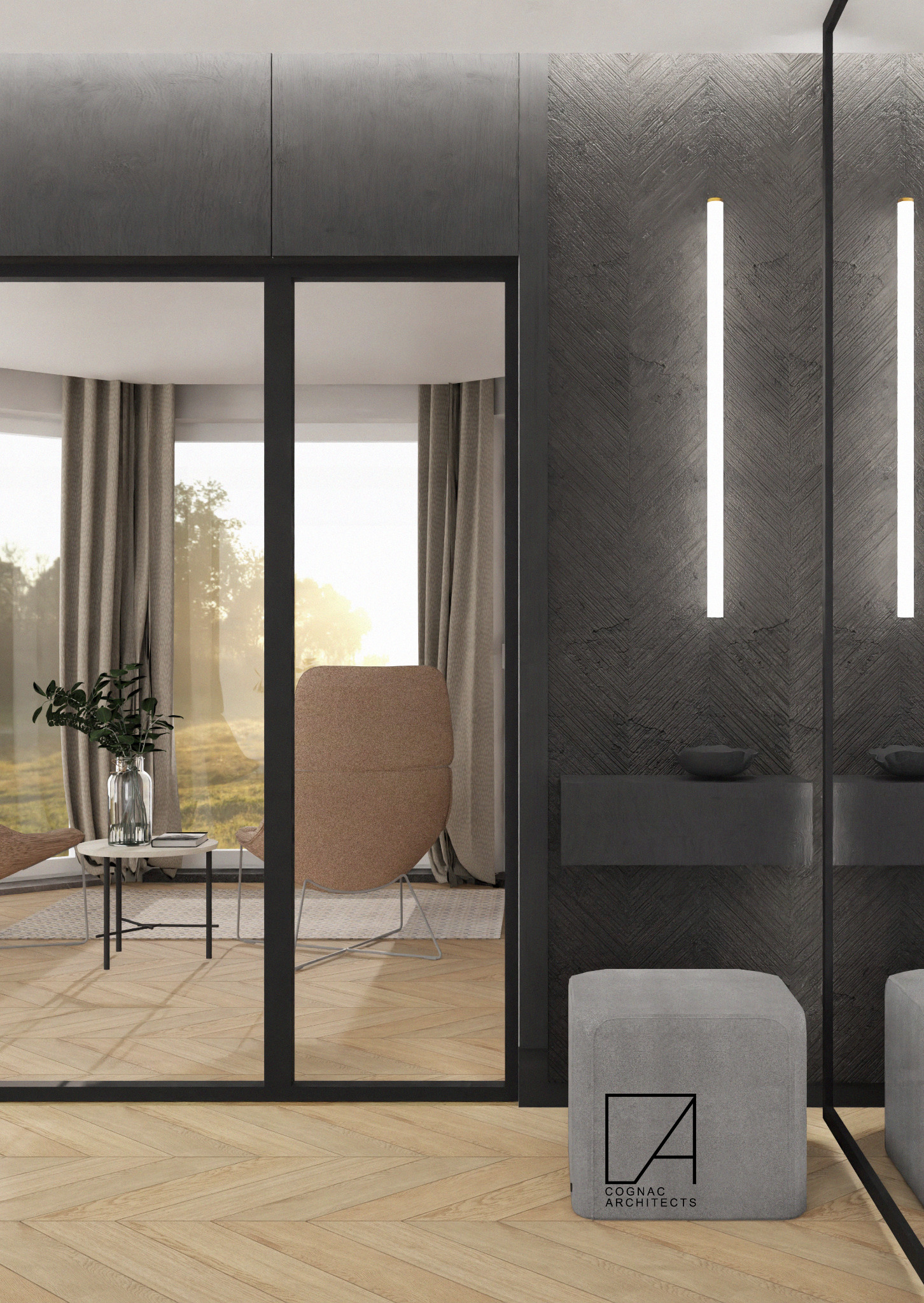 Wnętrze łazienki z szarą ścianą w jodełkę, podświetlanymi lustrami, drewnianą podłogą i pufą z logo firmy projektowej.