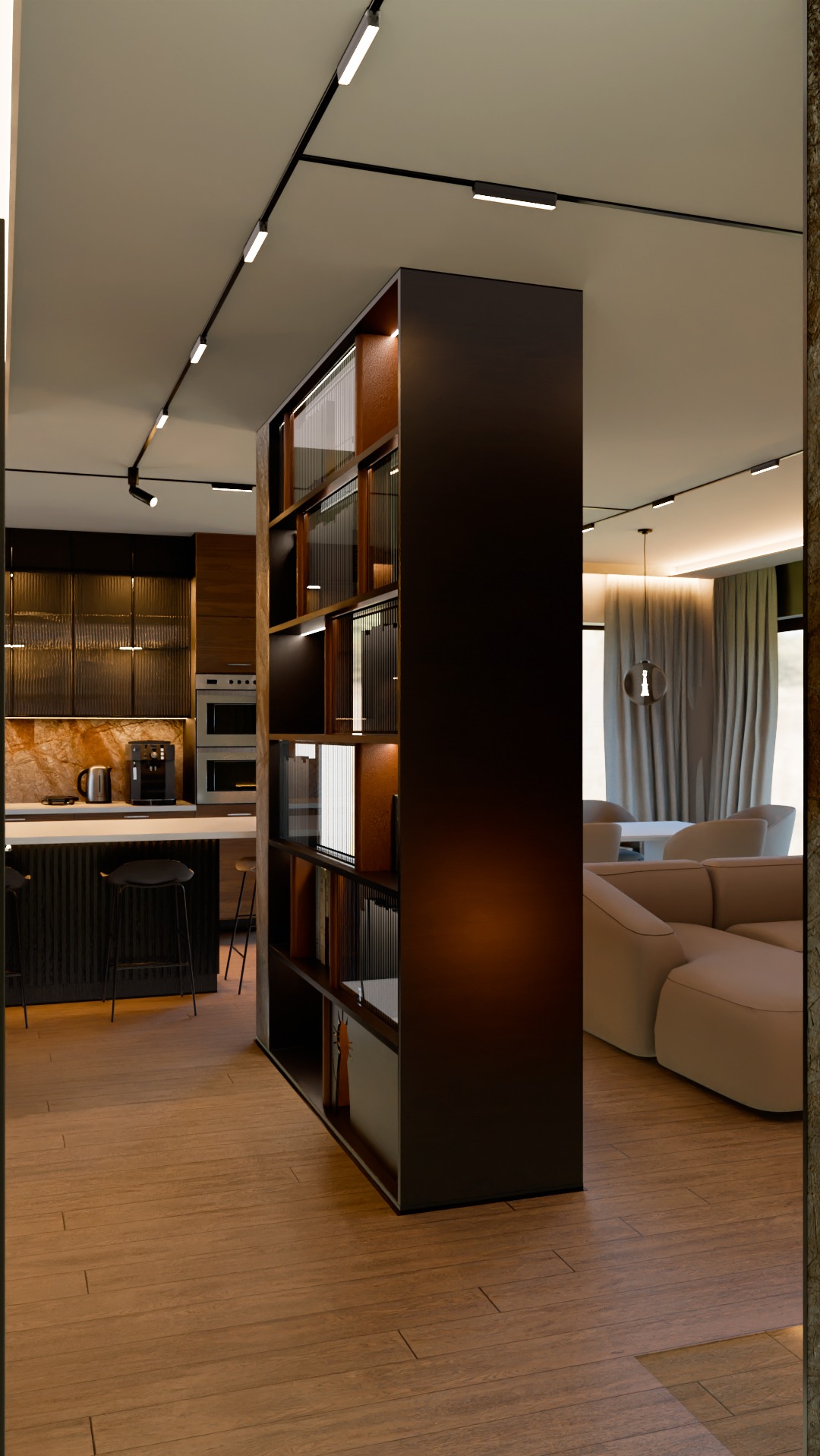 Nowoczesne wnętrze z otwartą kuchnią i salonem, oddzielone wysokim regałem z podświetlanymi półkami, drewniana podłoga, oświetlenie szynowe na suficie.