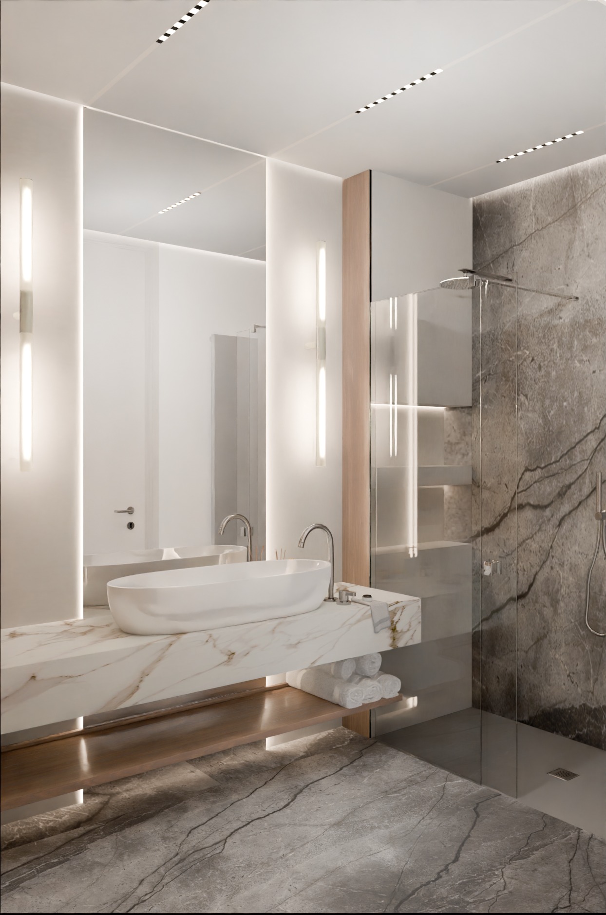 Nowoczesna łazienka z marmurową umywalką nablatową, podświetlanym lustrem i kabiną prysznicową z szarą marmurową ścianą.