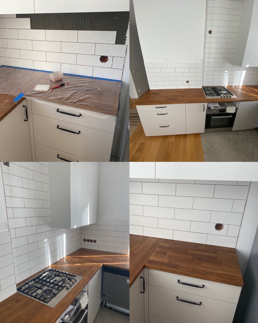 Montaż białych, podłużnych płytek na ścianie nad drewnianym blatem kuchennym, widoczne narzędzia i resztki kleju, w tle gotowa część ściany z płytkami.