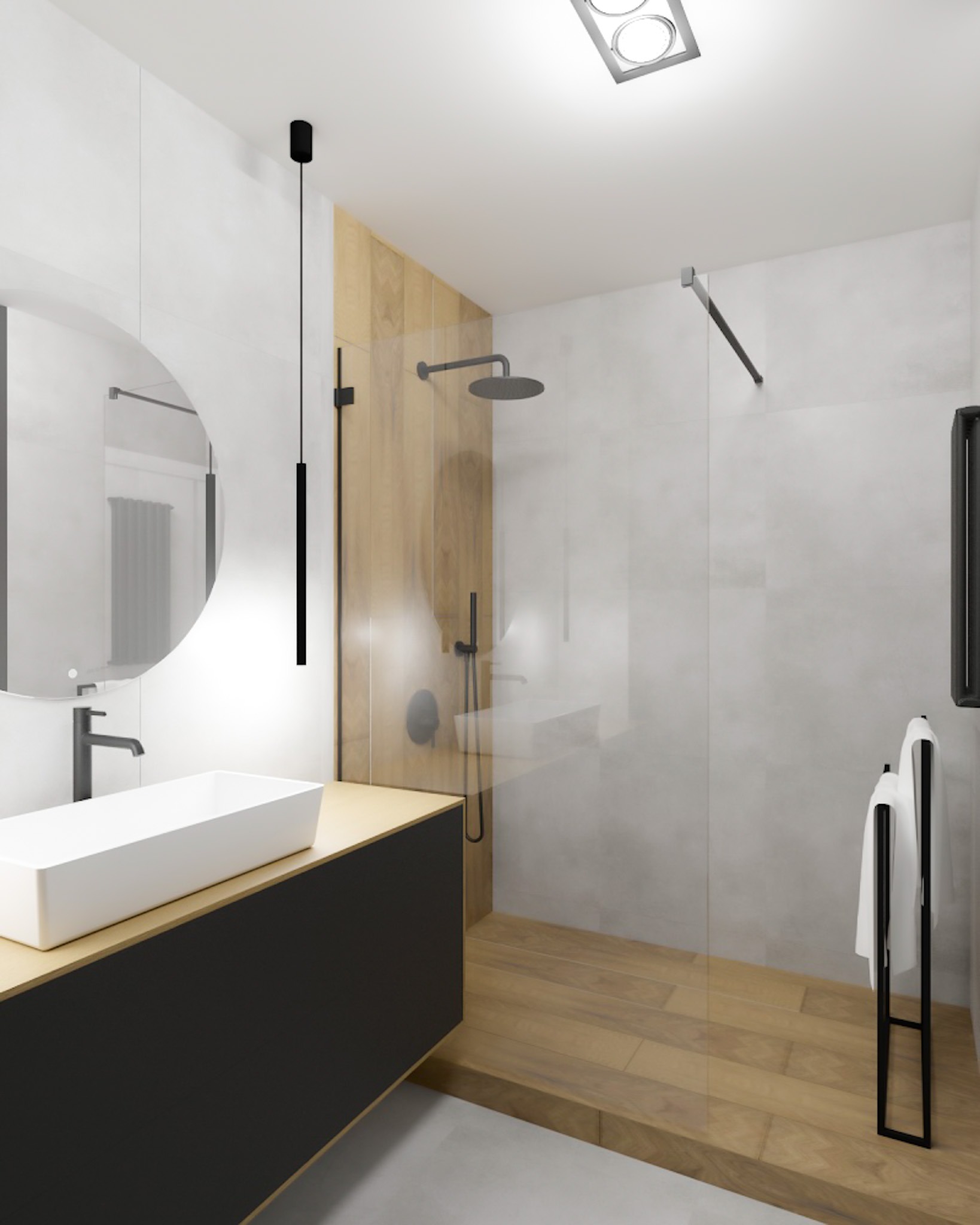 Nowoczesna łazienka z drewnianymi akcentami: prostokątna umywalka nablatowa, okrągłe lustro z podświetleniem, kabina prysznicowa typu walk-in z drewnianym panelem, czarny wieszak na ręczniki...