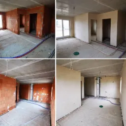 Wnętrze w stanie deweloperskim: ściany częściowo otynkowane, widoczne instalacje wodne i elektryczne, surowy betonowy strop.