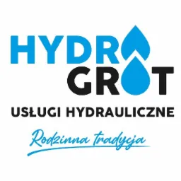 Logo firmy hydraulicznej HydroGrot z niebieską kroplą wody, czarnym napisem 'Usługi Hydrauliczne' i niebieskim hasłem 'Rodzinna Tradycja'.