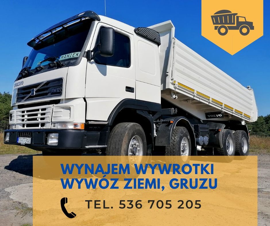 Biała ciężarówka wywrotka Volvo FM12 zaparkowana na ziemi, widoczna z przodu i boku, z napisem 'MANIEK' na przedniej szybie i numerem telefonu na dole zdjęcia.