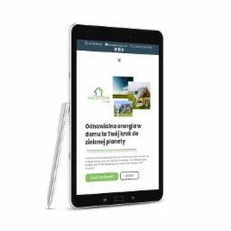 Tablet z wyświetloną stroną internetową firmy z Londonu, prezentującą ofertę odnawialnych źródeł energii, obok leży srebrny rysik.