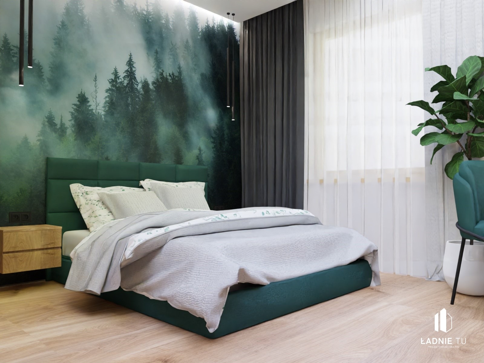 Sypialnia z łóżkiem o zielonej ramie i zagłówku, na ścianie fototapeta z motywem mglistego lasu, obok łóżka drewniana szafka nocna i roślina doniczkowa.