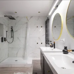 Nowoczesna łazienka z kabiną prysznicową typu walk-in z złotymi profilami, dwoma umywalkami nablatowymi z czarnymi bateriami ze złotymi akcentami, marmurowymi płytkami na ścianach i okrągłymi...