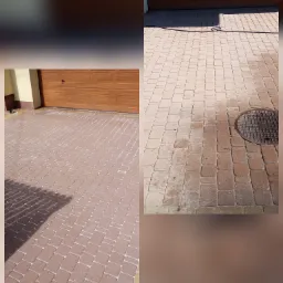 Częściowo wyczyszczona kostka brukowa przed garażem, widoczna różnica w kolorze między czystą a brudną powierzchnią, obok studzienka kanalizacyjna.