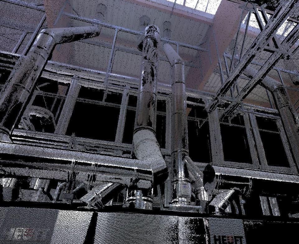 Widok z dołu na skomplikowany system rur i konstrukcji stalowych w hali przemysłowej, oświetlony przez okna dachowe.