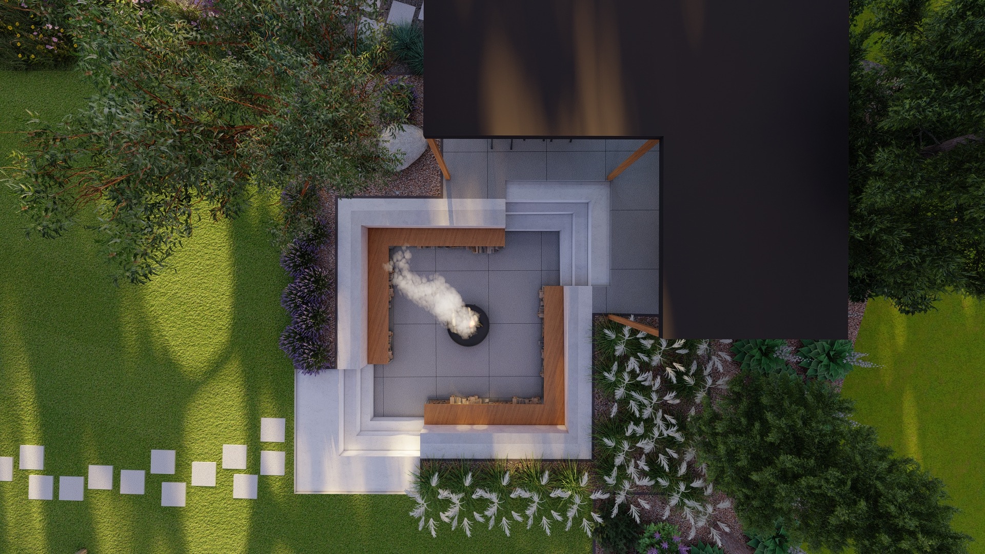 Widok z góry na nowoczesny ogród z paleniskiem otoczonym siedziskami i roślinnością, z widocznym dymem unoszącym się z ogniska.