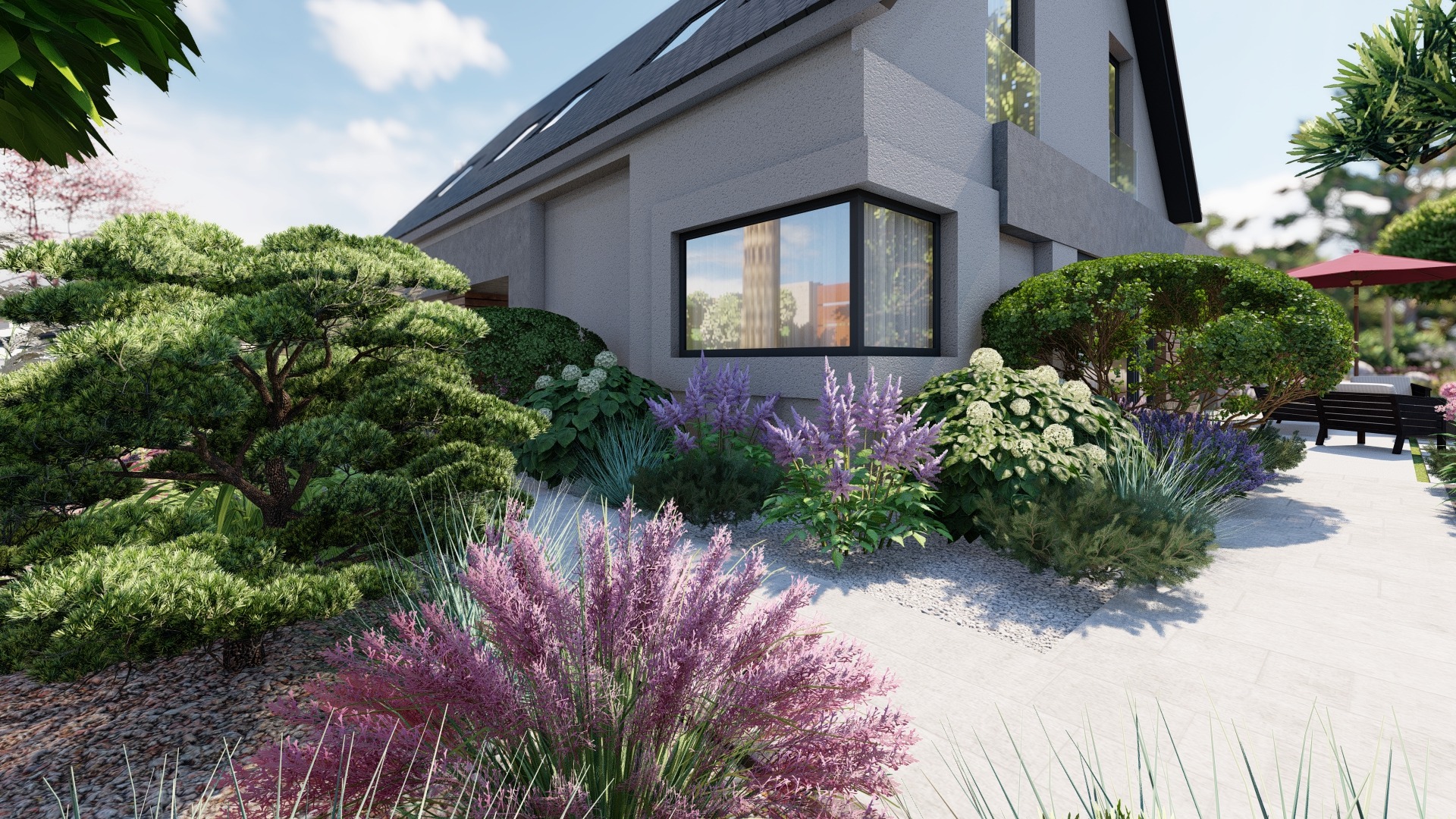 Nowoczesny dom z szarą elewacją otoczony bujną roślinnością: sosna bonsai, hortensje, trawy ozdobne i lawenda, z widoczną ścieżką z jasnych płyt prowadzącą do strefy relaksu z parasolem.